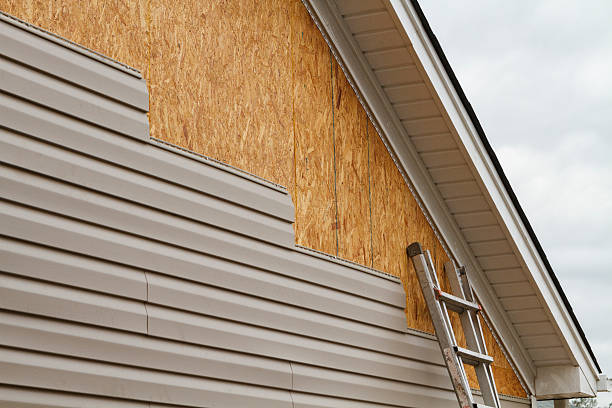 Professional Storm Damage Siding Repair technician working in Belmont, NC